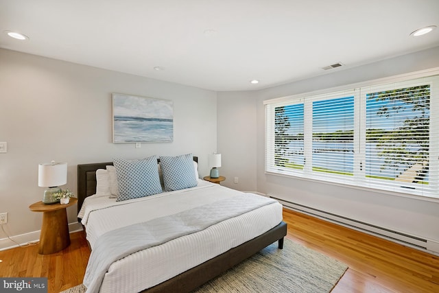 3442 Rockway Ave, Annapolis, MD 21403 - bedroom featuring wood finished floors, recessed lighting, baseboards, and baseboard heating
