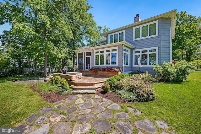 3442 Rockway Ave, Annapolis, MD 21403 - back of property with a sunroom, a chimney, and a deck
