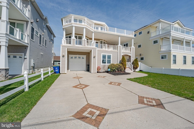 1107 Ocean Ave, Brigantine, NJ 08203 - view of front of house with a garage and driveway