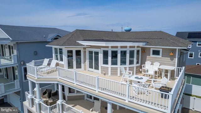 1107 Ocean Ave, Brigantine, NJ 08203 - rear view of house featuring roof with shingles, french doors, a deck, and a patio