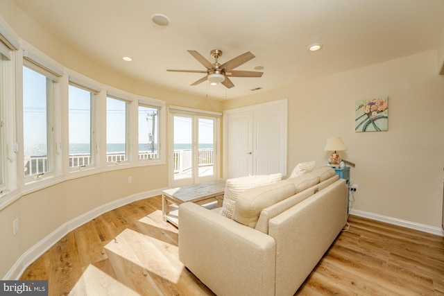 1107 Ocean Ave, Brigantine, NJ 08203 - living room with baseboards, a ceiling fan, light wood finished floors, a water view, and recessed lighting