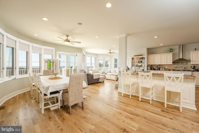 1107 Ocean Ave, Brigantine, NJ 08203 - dining room with a ceiling fan, recessed lighting, light wood-style flooring, baseboards, and ornate columns