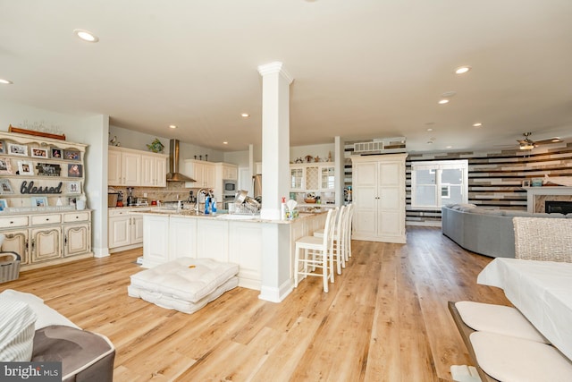 1107 Ocean Ave, Brigantine, NJ 08203 - living area with a ceiling fan, recessed lighting, light wood-type flooring, and a fireplace