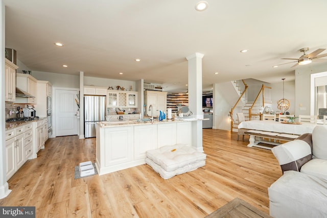 1107 Ocean Ave, Brigantine, NJ 08203 - kitchen featuring stainless steel appliances, open floor plan, a ceiling fan, recessed lighting, and light wood-style flooring