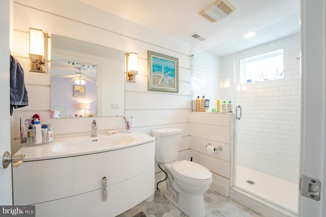 1107 Ocean Ave, Brigantine, NJ 08203 - bathroom featuring ceiling fan, a stall shower, toilet, vanity, and tile patterned floors