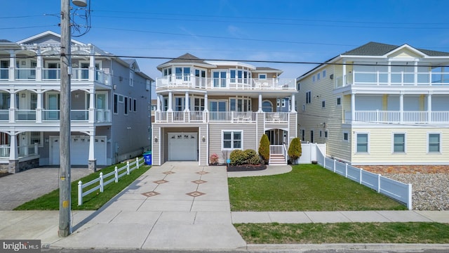 1107 Ocean Ave, Brigantine, NJ 08203 - view of front of home featuring an attached garage, driveway, and a balcony