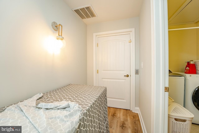 1107 Ocean Ave, Brigantine, NJ 08203 - bedroom featuring washer / clothes dryer and light wood-style flooring