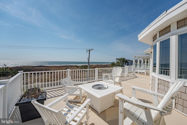 1107 Ocean Ave, Brigantine, NJ 08203 - view of patio featuring an outdoor fire pit and a water view