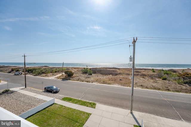 1107 Ocean Ave, Brigantine, NJ 08203 - view of asphalt street featuring street lights, a water view, and sidewalks