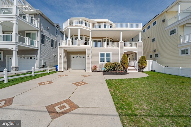 1107 Ocean Ave, Brigantine, NJ 08203 - view of front facade featuring an attached garage and concrete driveway