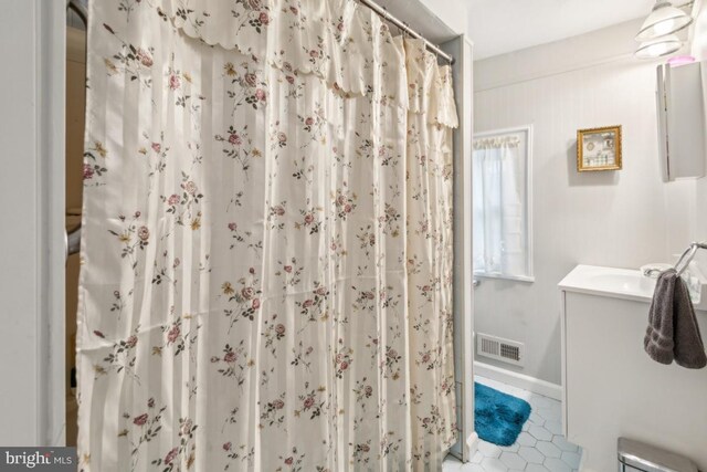 137 2nd St, Bordentown, NJ 08505 - full bathroom featuring vanity, tile patterned flooring, and a shower with shower curtain