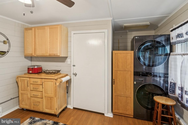 137 2nd St, Bordentown, NJ 08505 - laundry area featuring stacked washer and clothes dryer, wood finished floors, ornamental molding, and a ceiling fan