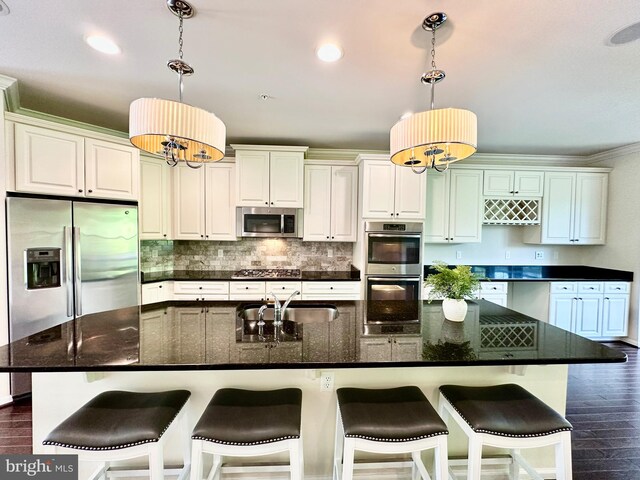 6967 Country Club Ter, New Market, MD 21774 - kitchen featuring stainless steel appliances, a sink, dark wood-type flooring, backsplash, and a large island with sink
