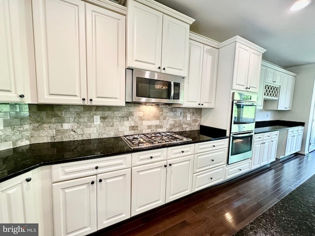 6967 Country Club Ter, New Market, MD 21774 - kitchen featuring stainless steel appliances, dark wood-type flooring, white cabinetry, backsplash, and crown molding