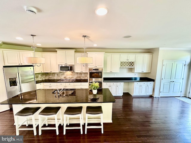 6967 Country Club Ter, New Market, MD 21774 - kitchen featuring appliances with stainless steel finishes, a sink, ornamental molding, hanging light fixtures, and a kitchen bar