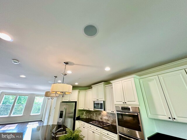 6967 Country Club Ter, New Market, MD 21774 - kitchen with appliances with stainless steel finishes, recessed lighting, backsplash, a sink, and pendant lighting