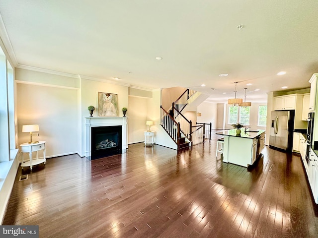6967 Country Club Ter, New Market, MD 21774 - living area with stairs, dark wood-type flooring, crown molding, a fireplace with flush hearth, and recessed lighting