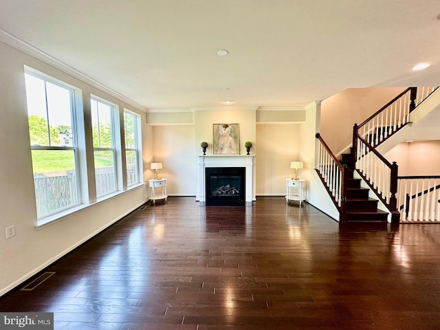 6967 Country Club Ter, New Market, MD 21774 - unfurnished living room featuring crown molding, hardwood / wood-style floors, stairway, a glass covered fireplace, and baseboards