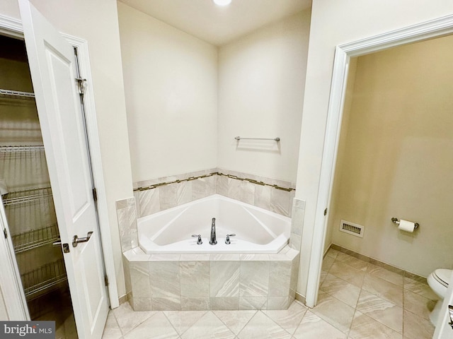 6967 Country Club Ter, New Market, MD 21774 - bathroom with a garden tub, toilet, baseboards, and tile patterned floors