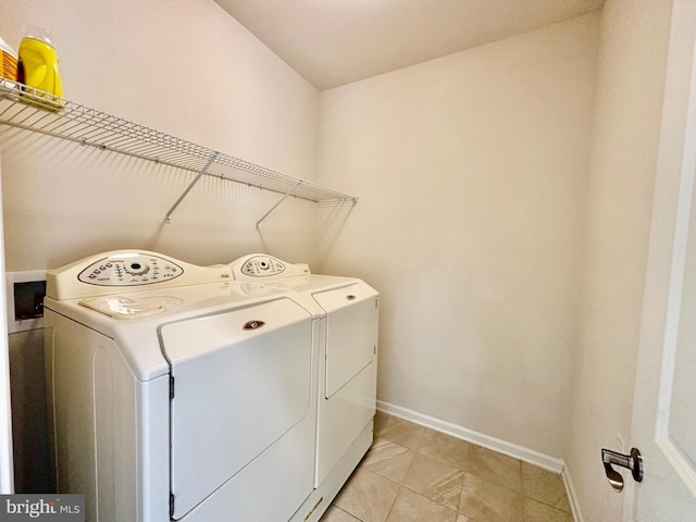 6967 Country Club Ter, New Market, MD 21774 - washroom featuring washing machine and dryer, baseboards, and light tile patterned floors