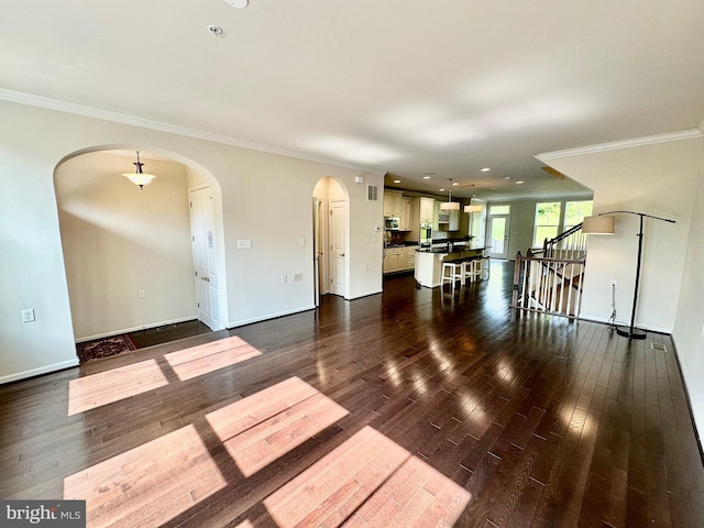 6967 Country Club Ter, New Market, MD 21774 - unfurnished living room with arched walkways, dark wood-style floors, ornamental molding, stairway, and baseboards