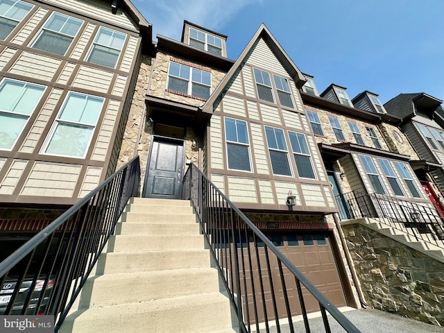 6967 Country Club Ter, New Market, MD 21774 - view of front of property with a garage, stone siding, and stairs
