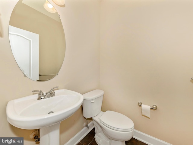 739 Hidden Marsh St, Gaithersburg, MD 20877 - half bathroom featuring baseboards, toilet, a sink, and tile patterned floors