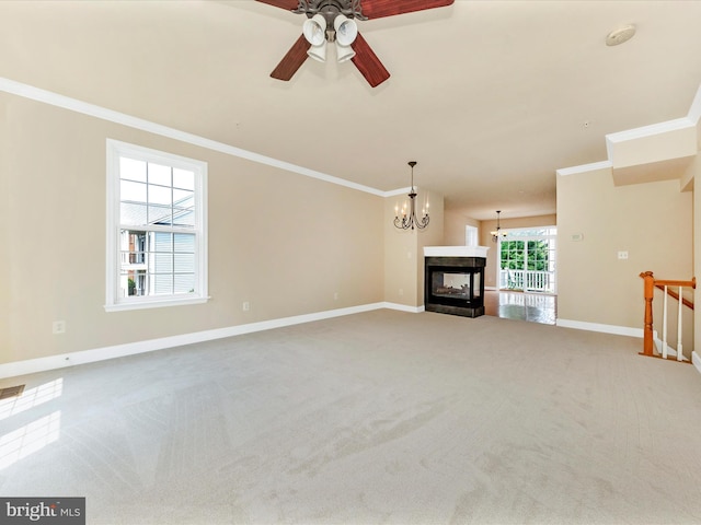 739 Hidden Marsh St, Gaithersburg, MD 20877 - unfurnished living room with crown molding, baseboards, carpet, ceiling fan, and a chandelier