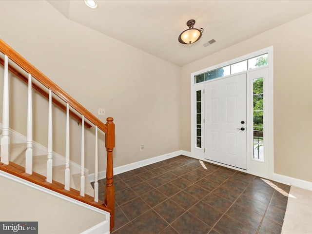 739 Hidden Marsh St, Gaithersburg, MD 20877 - foyer featuring plenty of natural light, stairway, baseboards, and dark tile patterned floors