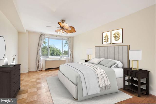 1900 Lyttonsville Rd NE Unit 509, Silver Spring, MD 20910 - bedroom with radiator and a ceiling fan