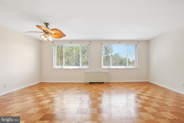 1900 Lyttonsville Rd NE Unit 509, Silver Spring, MD 20910 - unfurnished room featuring radiator and a ceiling fan