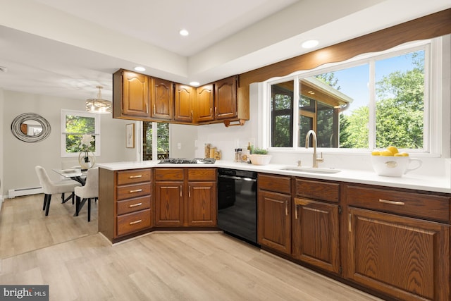5404 Nedra Ave, Alexandria, VA 22310 - kitchen with dishwasher, a sink, a baseboard radiator, light wood-style floors, and light countertops