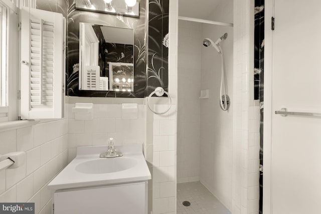 5404 Nedra Ave, Alexandria, VA 22310 - full bathroom with a shower stall, vanity, and tile walls