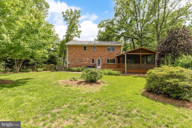 5404 Nedra Ave, Alexandria, VA 22310 - rear view of house with a sunroom, brick siding, a chimney, and a lawn