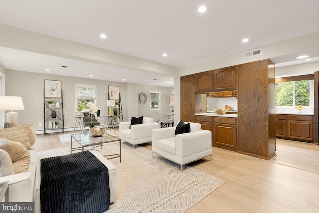 5404 Nedra Ave, Alexandria, VA 22310 - living room featuring light wood finished floors, recessed lighting, and a baseboard heating unit