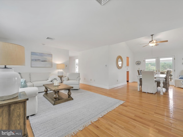 2054 Buckskin Cv, Auburn, PA 17922 - living area featuring ceiling fan, light wood-style floors, baseboards, and lofted ceiling