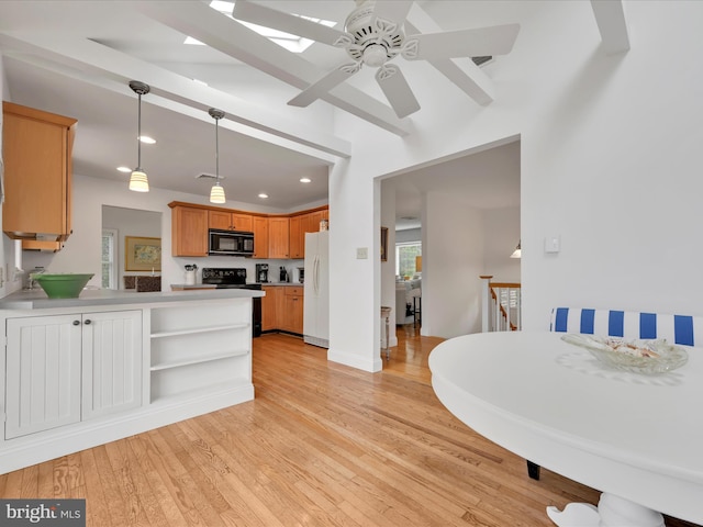 2054 Buckskin Cv, Auburn, PA 17922 - kitchen with black appliances, a peninsula, light wood-type flooring, recessed lighting, and a ceiling fan
