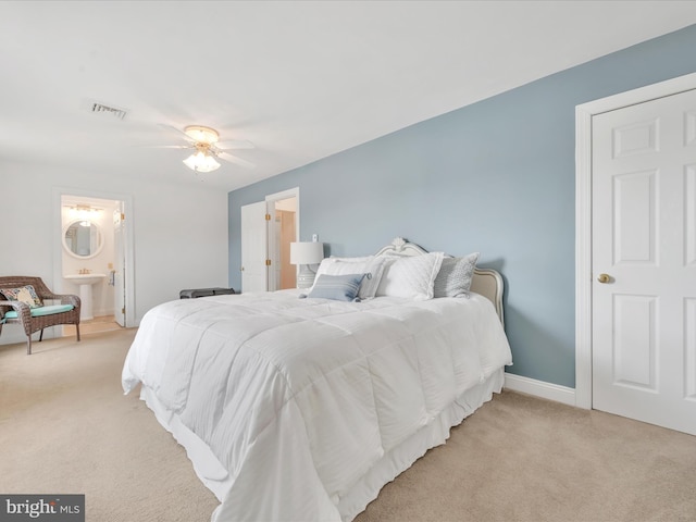 2054 Buckskin Cv, Auburn, PA 17922 - bedroom with light carpet, baseboards, a sink, and ensuite bath