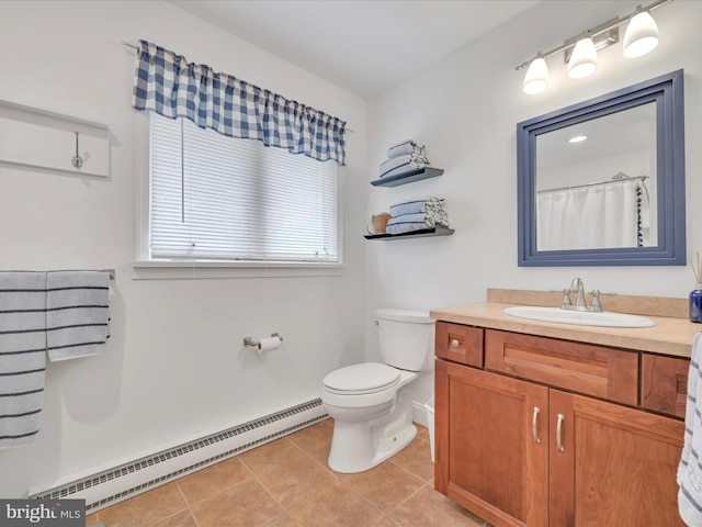 2054 Buckskin Cv, Auburn, PA 17922 - full bathroom featuring baseboard heating, vanity, toilet, tile patterned flooring, and baseboards