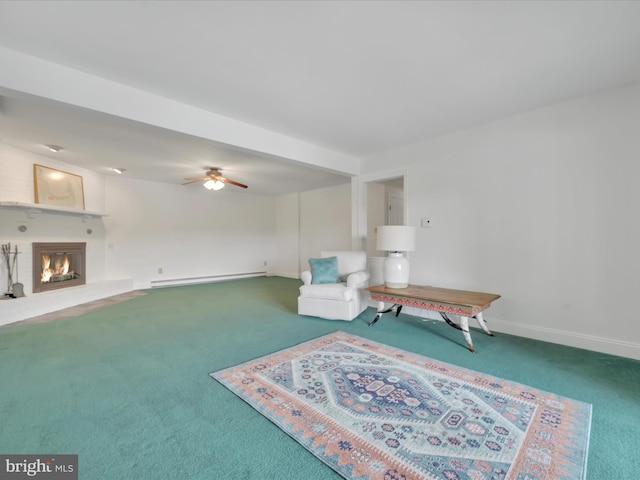 2054 Buckskin Cv, Auburn, PA 17922 - living area featuring carpet flooring, baseboard heating, a large fireplace, and baseboards