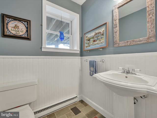 2054 Buckskin Cv, Auburn, PA 17922 - bathroom with a baseboard heating unit, wainscoting, toilet, and a sink