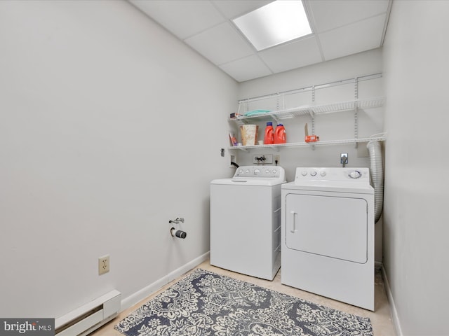 2054 Buckskin Cv, Auburn, PA 17922 - laundry area featuring separate washer and dryer, baseboards, and a baseboard radiator