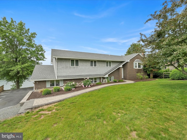 2054 Buckskin Cv, Auburn, PA 17922 - traditional-style house with brick siding and a front yard