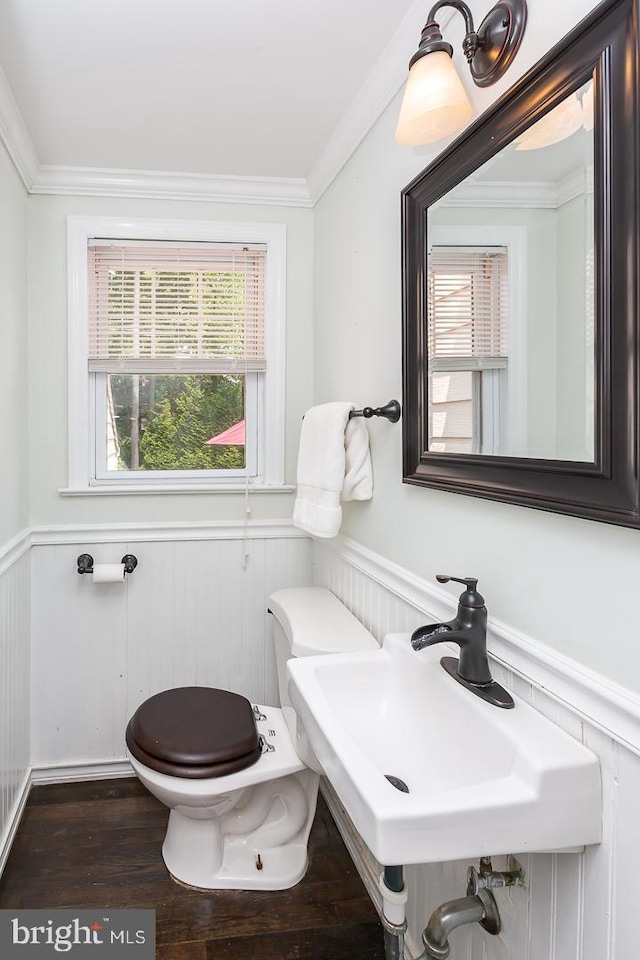 921 Coopertown Rd, Bryn Mawr, PA 19010 - half bath featuring toilet, a wainscoted wall, a sink, crown molding, and wood finished floors