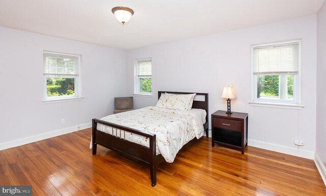 921 Coopertown Rd, Bryn Mawr, PA 19010 - bedroom featuring baseboards and wood finished floors
