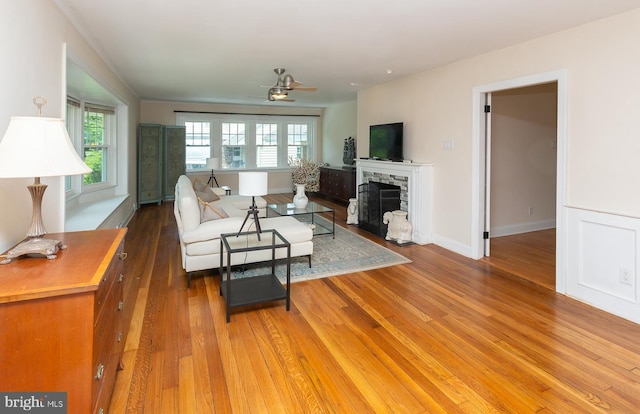 921 Coopertown Rd, Bryn Mawr, PA 19010 - living room featuring healthy amount of natural light, a ceiling fan, a fireplace, and light wood-type flooring