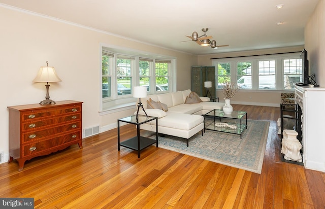 921 Coopertown Rd, Bryn Mawr, PA 19010 - living area featuring light wood-type flooring, baseboards, ornamental molding, and ceiling fan