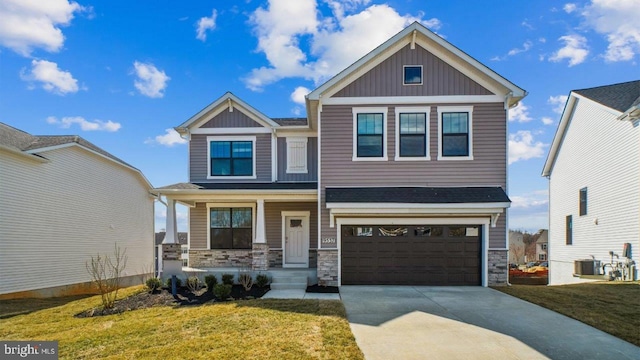 475 Ensemble Way, Frederick, MD 21701 - craftsman-style home with board and batten siding, stone siding, an attached garage, and covered porch