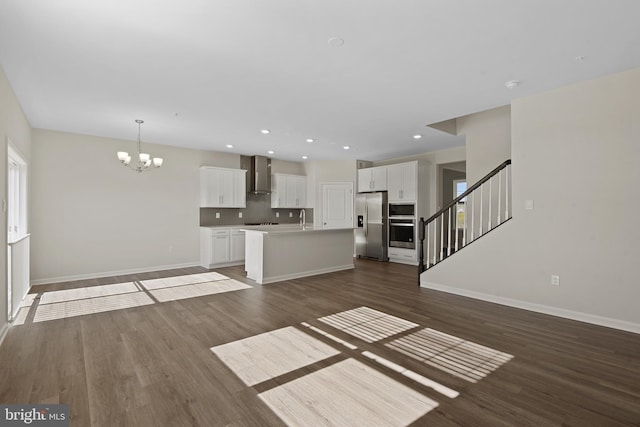 475 Ensemble Way, Frederick, MD 21701 - unfurnished living room featuring a chandelier, dark wood-style floors, baseboards, stairway, and recessed lighting