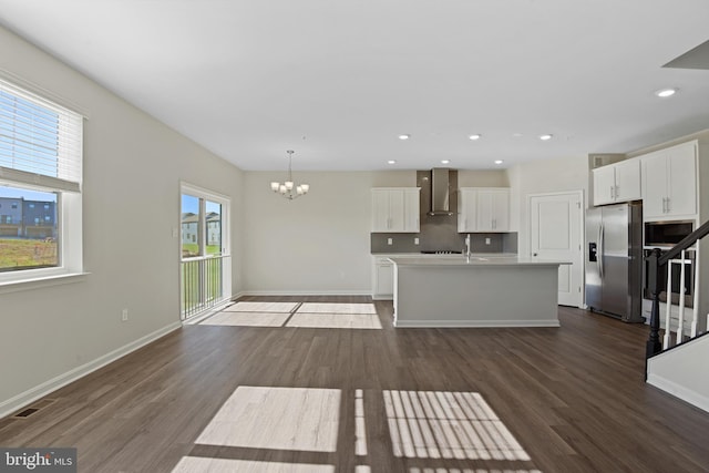 475 Ensemble Way, Frederick, MD 21701 - kitchen featuring appliances with stainless steel finishes, wall chimney exhaust hood, dark wood-style floors, a chandelier, and recessed lighting